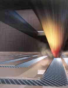 Thermochemical nanolithography: the tip of an atomic force microscope uses heat to turn graphene oxide into reduced graphene oxide, a substance that can be used to produce nanocircuits. Image Credit: University of Illinois at Urbana-Champaign.